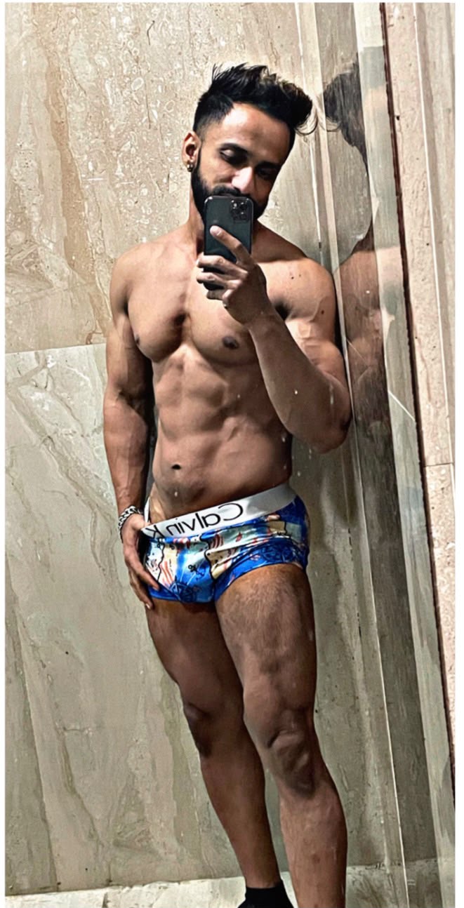 Aamir Siddique, personal trainer, showing his physique